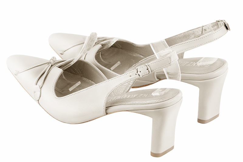 Off white women's open back shoes, with a knot. Tapered toe. Medium comma heels. Rear view - Florence KOOIJMAN